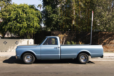 Side view of car parked on road