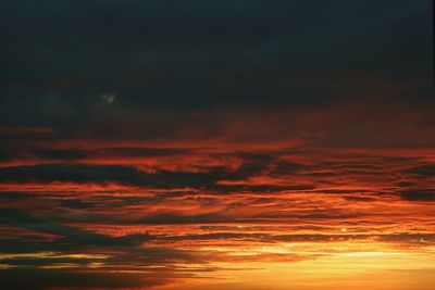 Low angle view of dramatic sky during sunset