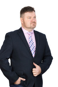 Mid adult man standing against white background
