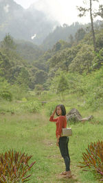 Full length of man standing on mountain