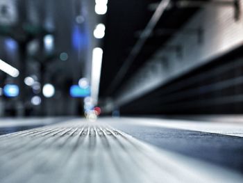 Surface level of illuminated railroad station platform