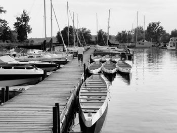 Boats moored at harbor