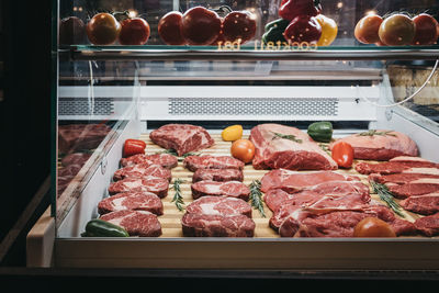 Meat and vegetables on display at store