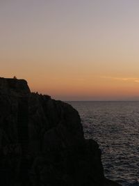 Scenic view of sea against sky at sunset