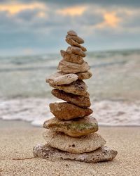 Close-up of stack of pebbles on beach