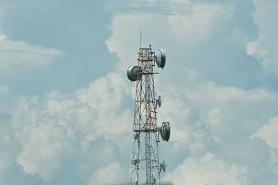 Low angle view of communications tower against sky