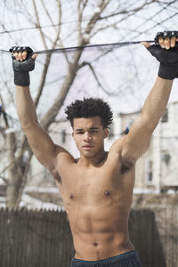 Young male boxer posing in the snow