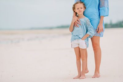 Full length of woman standing at beach