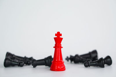 Close-up of chess pieces against white background