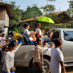 People by car during religious rally