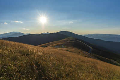 Scenic view of mountains against sky during sunset