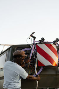 African american black man with a bicycles in his camper van