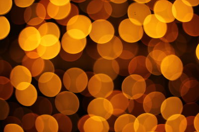 Defocused image of illuminated orange lights