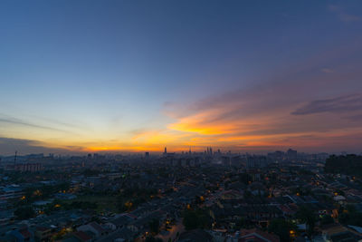 Aerial view of city at sunset