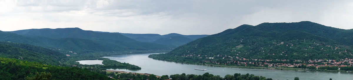 Panoramic view of river and mountains against sky