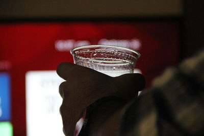 Close-up of hand holding drink