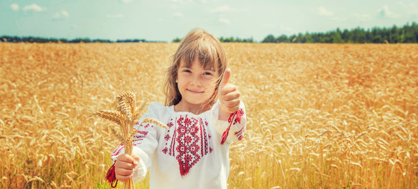 Young woman standing on field