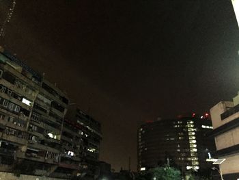 Low angle view of illuminated building at night