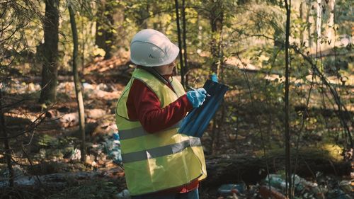 Biologist working in forest