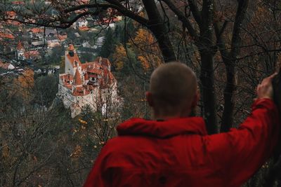 Rear view of man looking at bran castle