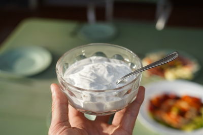 Cropped image of person holding ice cream