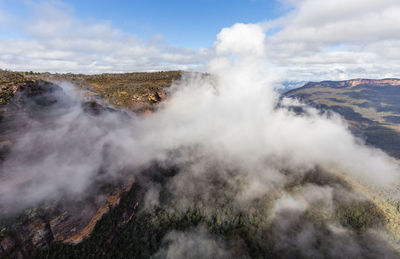 Clouds over countryside landscape