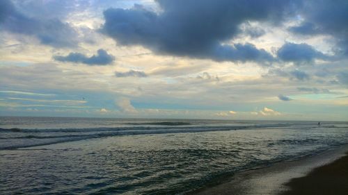 Scenic view of beach against sky during sunset