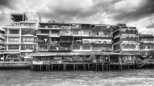 Old, wooden, traditional houses in bangkok chinatown alongside the chao phraya river