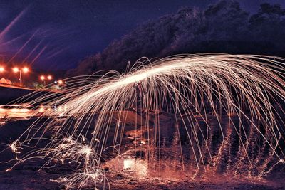 Light trails against sky at night