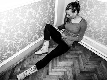 Young woman sitting at home