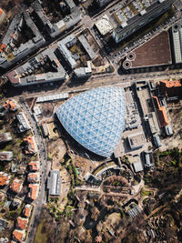 High angle view of triangular blue modern building in city