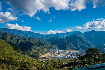 High angle view of mountains against blue sky