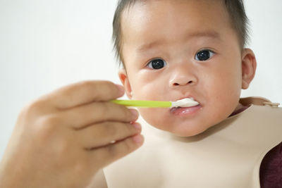 Portrait of cute boy eating baby
