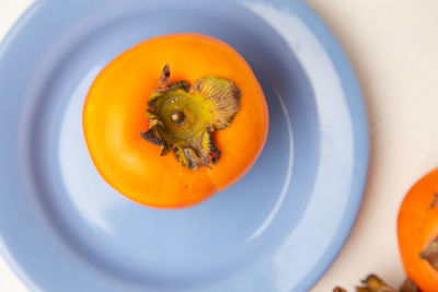 High angle view of orange slice in plate on table