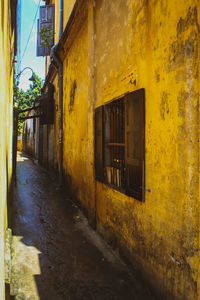 Alley amidst buildings in city