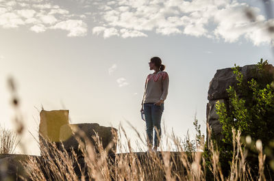 Woman standing against sky