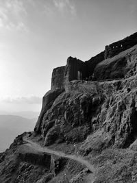 Rock formations on mountain against sky