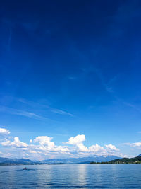 Scenic view of sea against blue sky