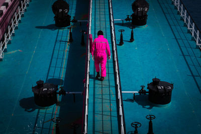 High angle view of manual worker walking in ship