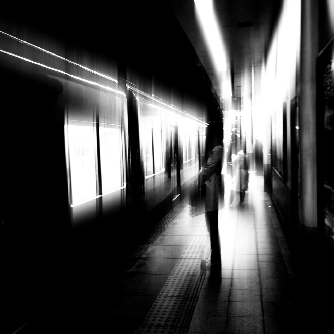 indoors, lifestyles, transportation, men, illuminated, railroad station platform, walking, railroad station, full length, public transportation, person, passenger, subway, subway station, rear view, leisure activity, travel, city life