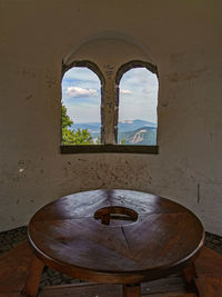 Window on table against wall in old building