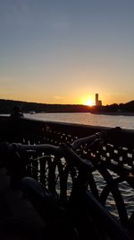 Scenic view of sea against clear sky during sunset