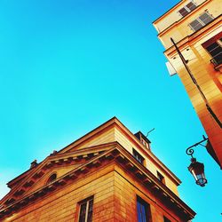 Low angle view of building against clear blue sky