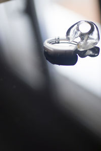 Close-up of wedding rings on table