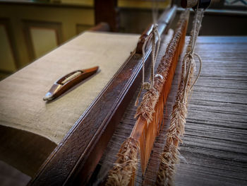 High angle view of loom weaving in workshop