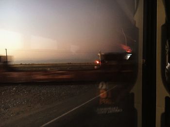 Railroad tracks seen through train windshield