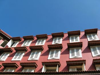 Low angle view of building against blue sky