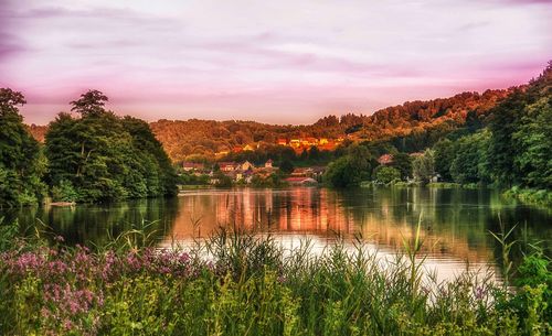 Scenic view of lake against sky during sunset