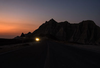 Scenic view of mountains against clear sky during sunset