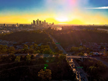 High angle view of city buildings during sunset